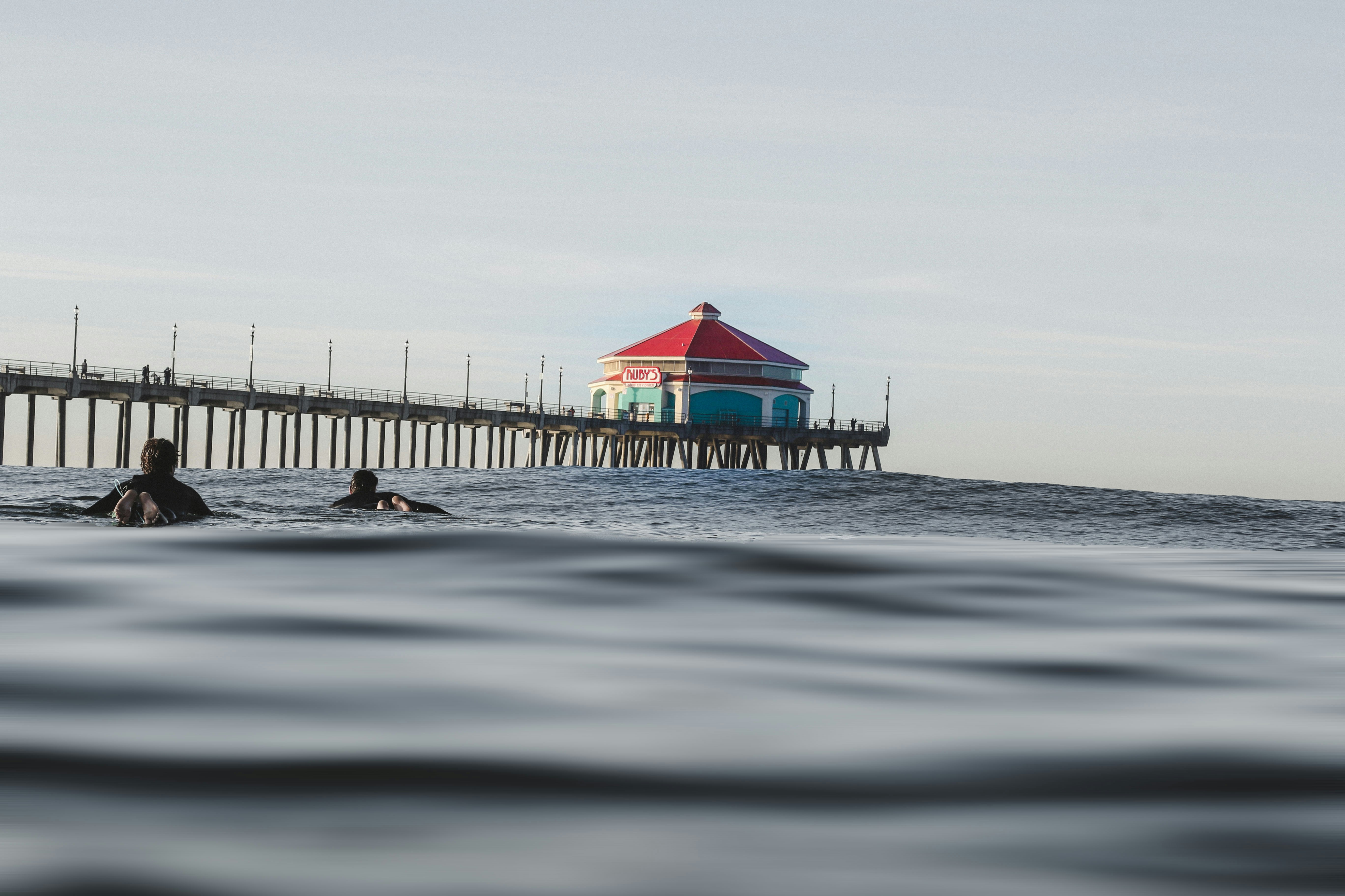 red and blue house near dock